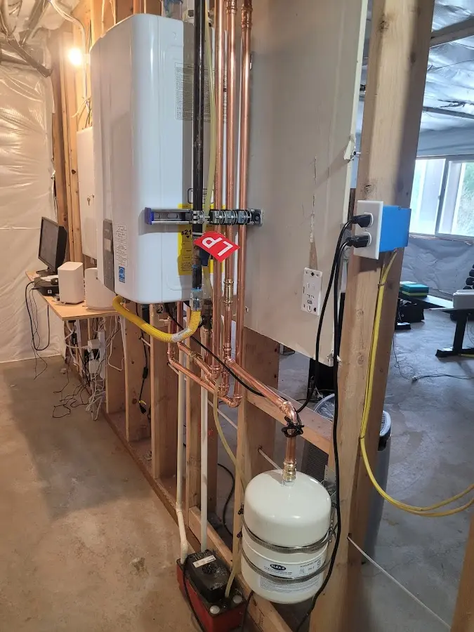 Licensed plumber repairing a kitchen sink in Oconto