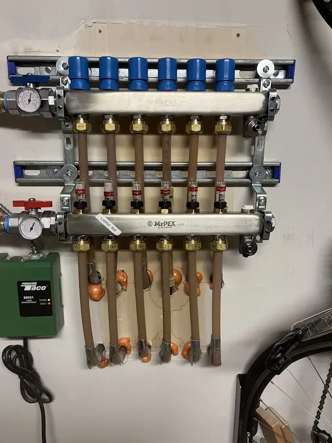 Plumber performing Water Heater Repair at a residential property in Oconto